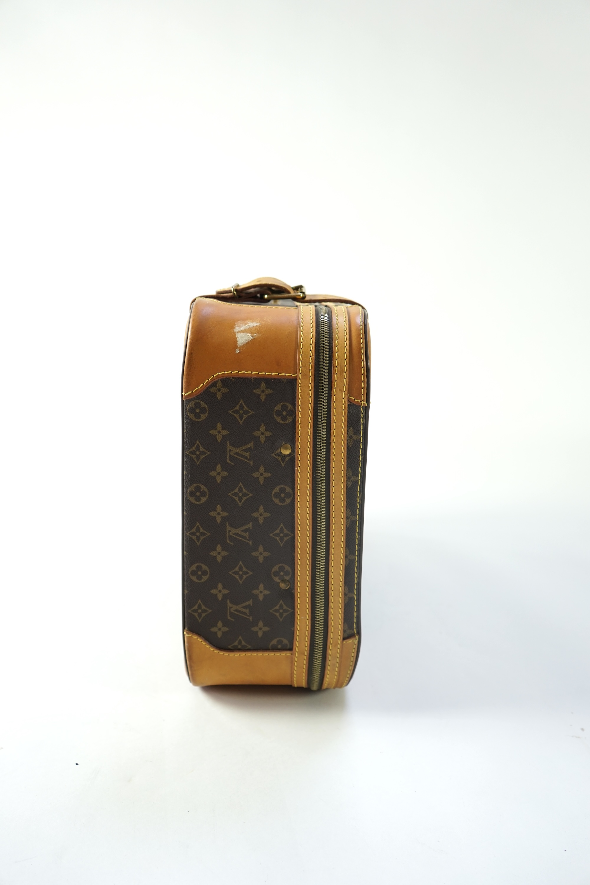 A Louis Vuitton monogrammed canvas with leather trim soft sided suitcase